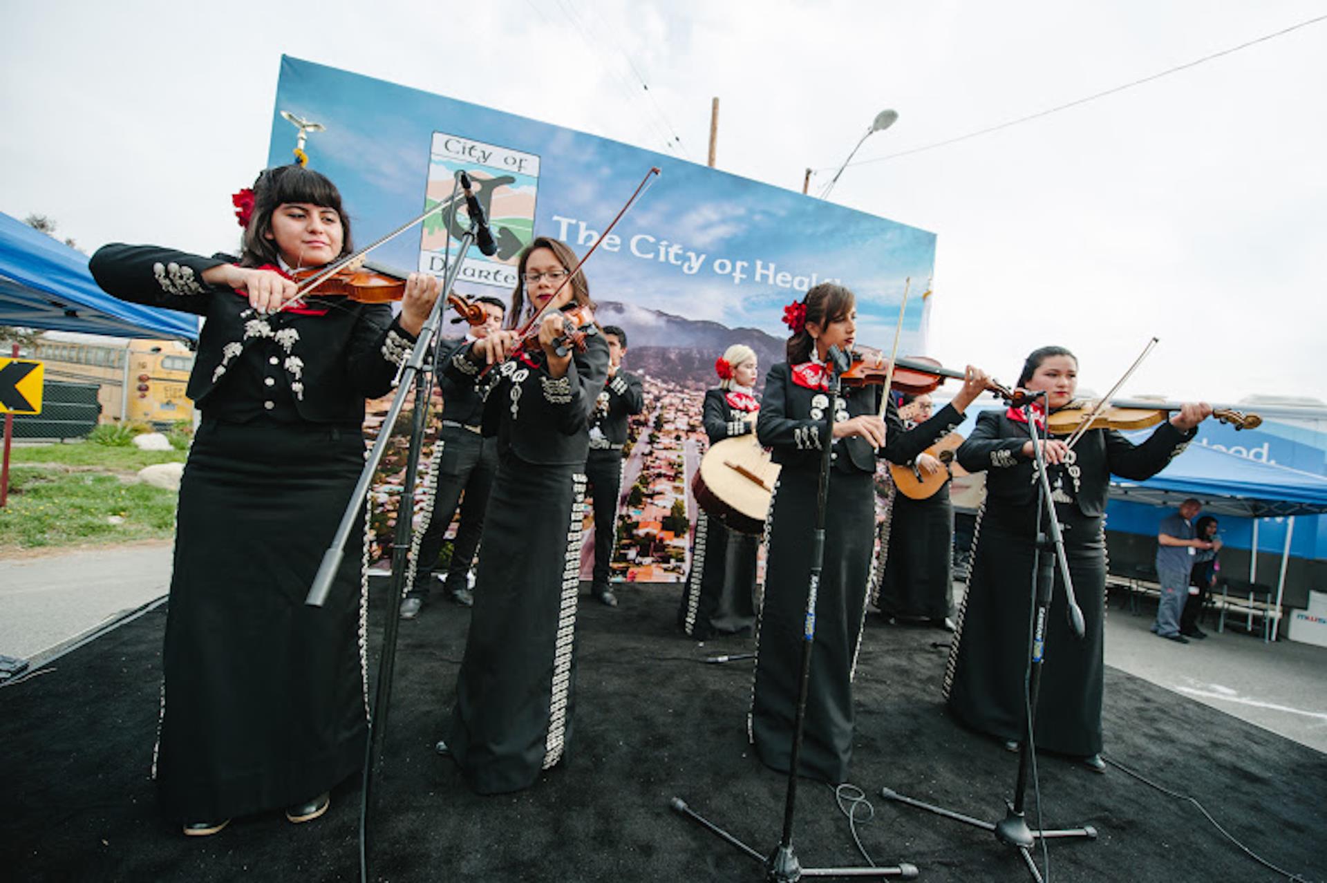 Duarte Community - musicians playing violin at community event